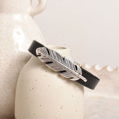 Flat black leather with a silver feather slider bead.