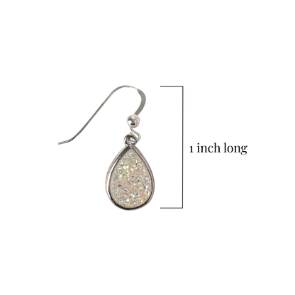 Teardrop-shaped earring with glittery design on a white background, labeled as 1 inch long.