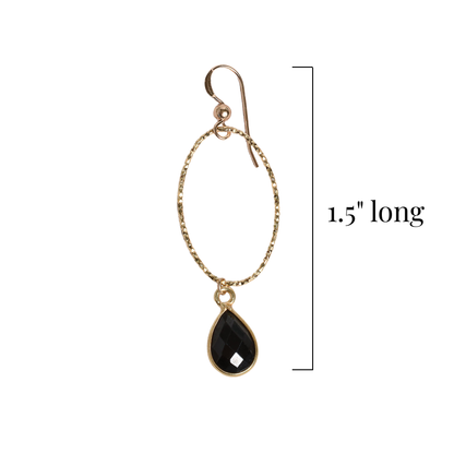 Gold earring with a black spinel teardrop pendant on a white background