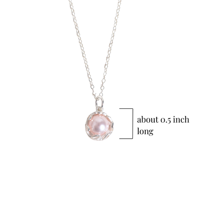 Pink pearl pendant measurements on a white background
