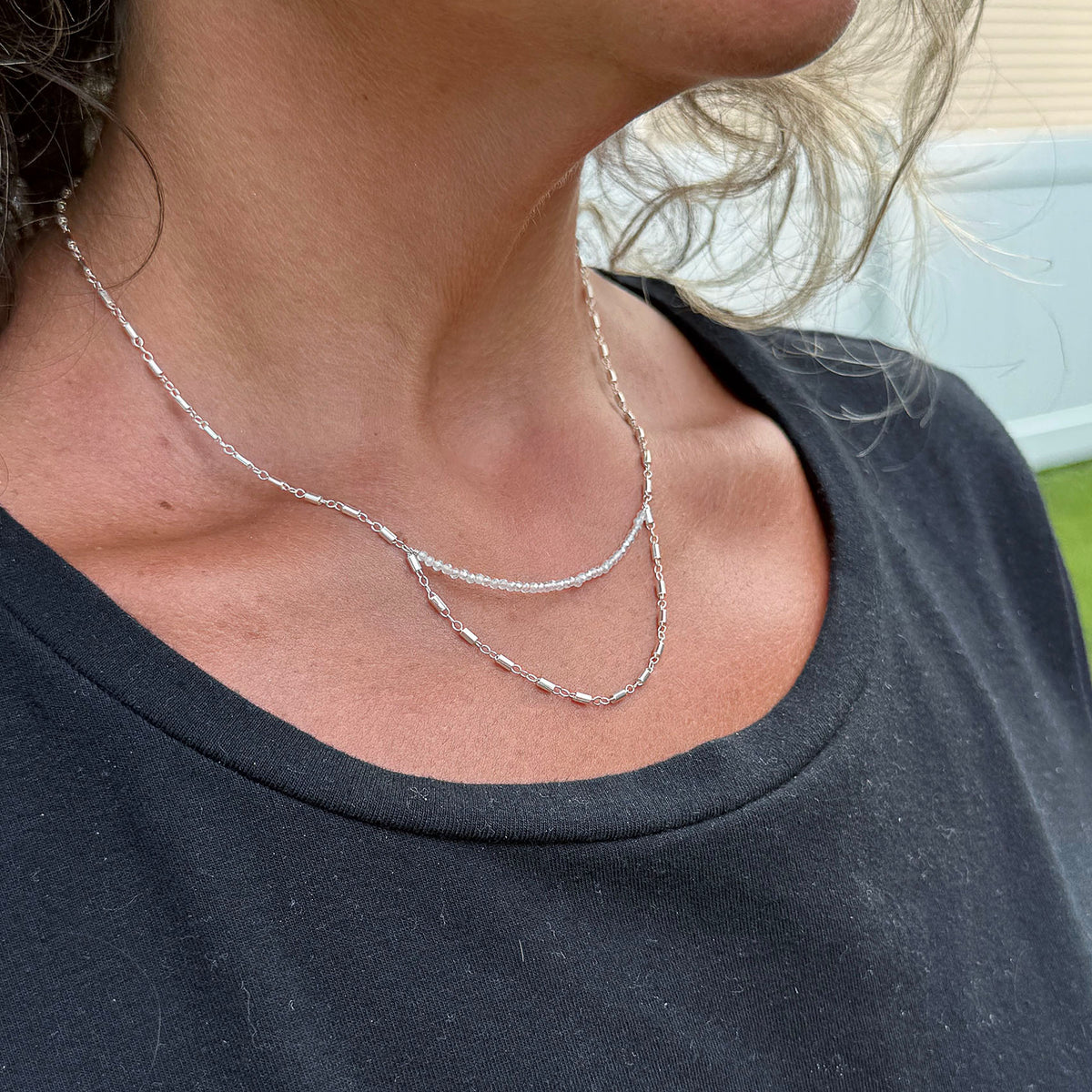 Sterling silver bar chain and dainty quartz beads create an unique pendant necklace.