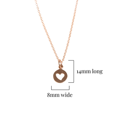 Rose gold necklace with heart pendant on a white background and its measurements 